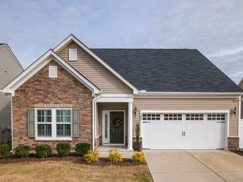 Brick-front house with a white double garage