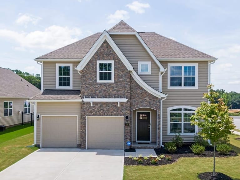 Two-story house with a double garage and stone trim