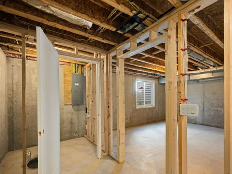 Unfinished lower level with timber framing