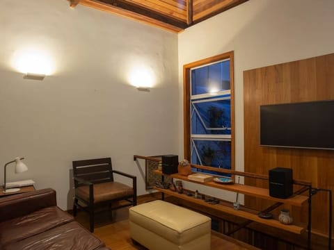 Living room with a sofa, a console table and a television