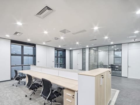 Modern office with desks and glass partitions
