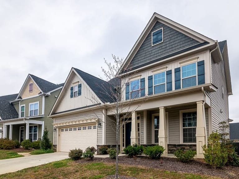 Two-story house with an attached garage and a front yard