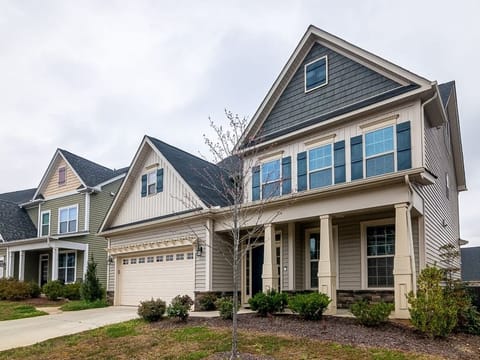 Two-story house with an attached garage and a front yard
