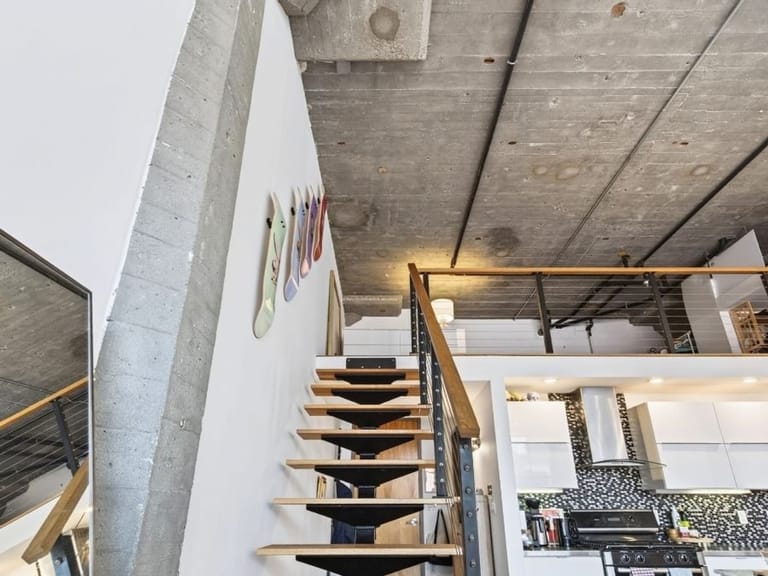 Open interior staircase against a white wall