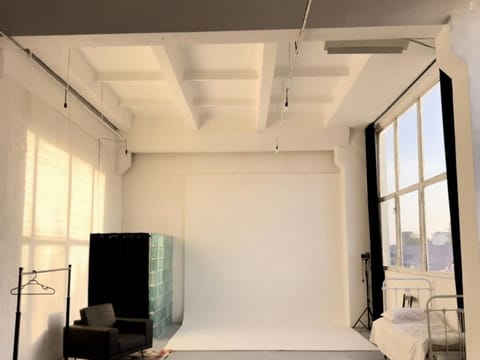 Empty room with tall windows and a high ceiling